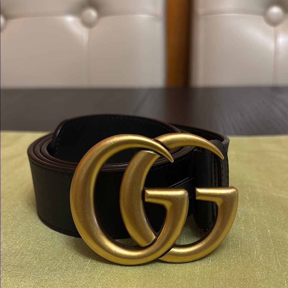 Gucci Black and Gold Belt with Iconic GG Buckle